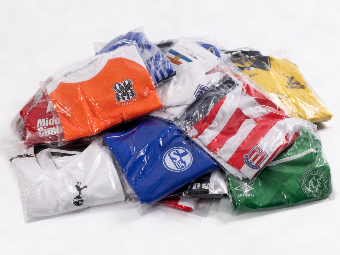 Mr. E Kit football shirts in clear bags showing stock prepared for review