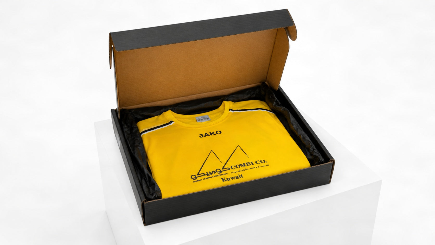 Open Mr. E Kit mystery football shirt box packed with a yellow football shirt